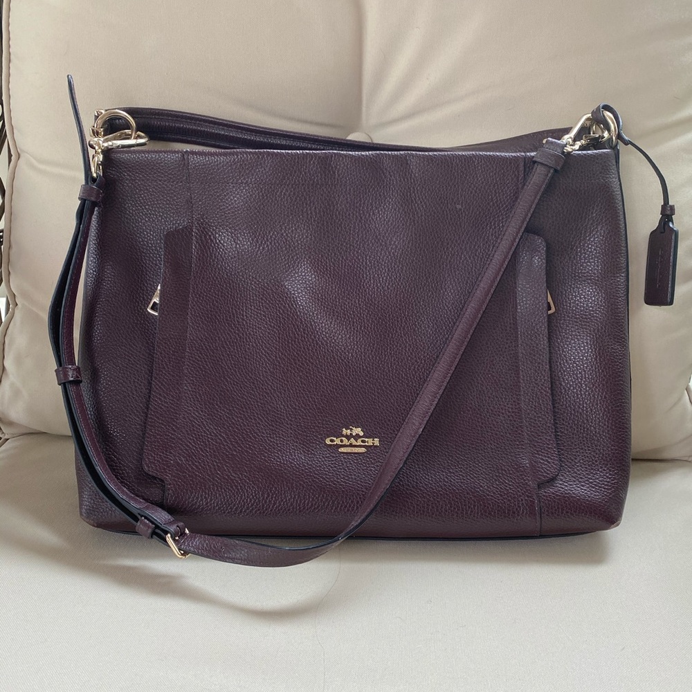 Burgundy colored Coach purse